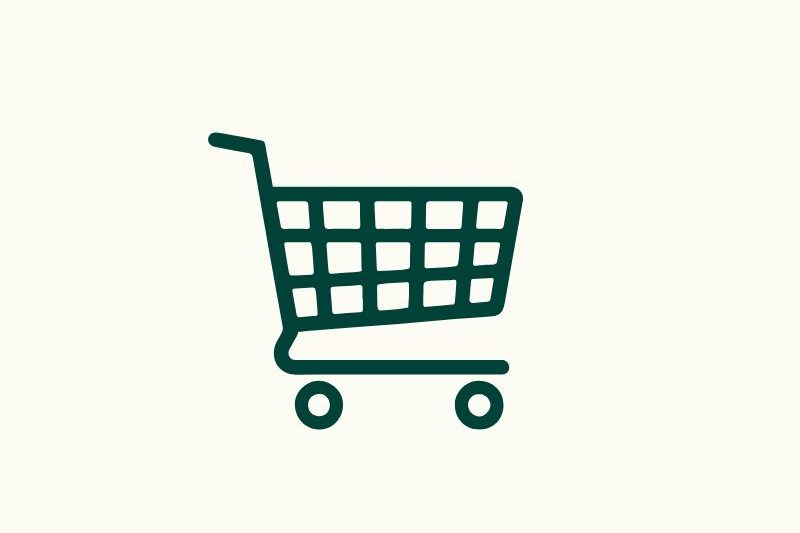 Einkaufswagen Symbol in grün auf hellem Hintergrund.